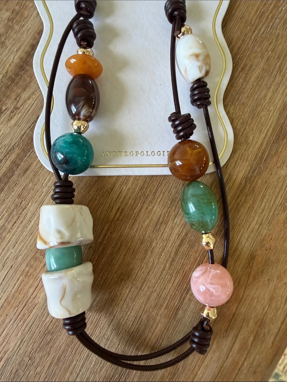 Anthropologie Multicolor Beaded Phone Charm with Gold Accents